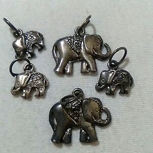 5 miniature elephant pendants plus 1 = 6 elephants